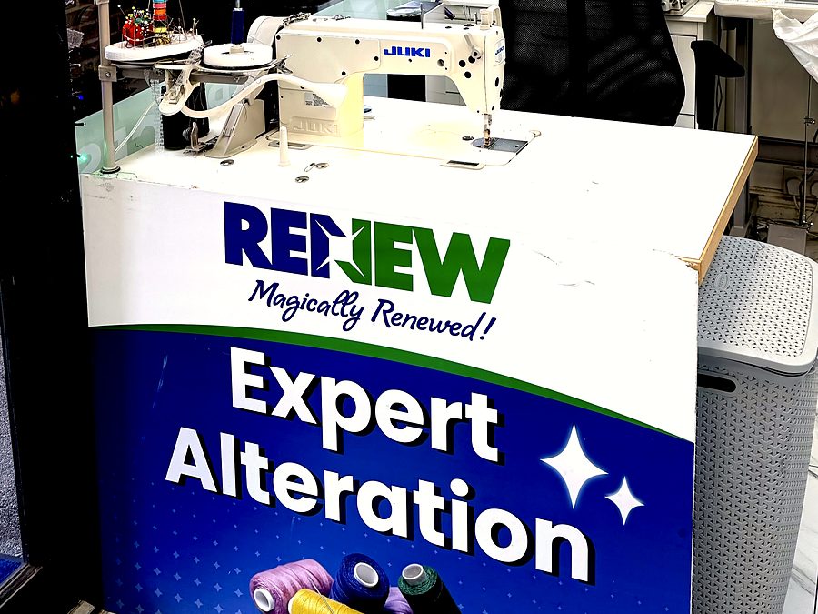 The alterations counter, with the industrial machine set up and ready